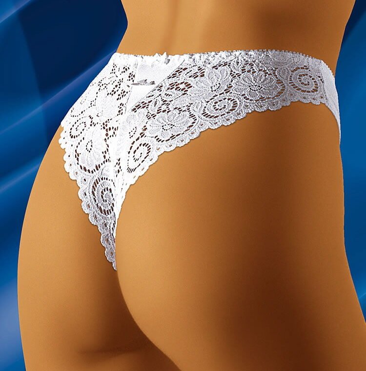 Wolbar Bolero thong with white floral lace design, high-cut style, shown on model against blue background