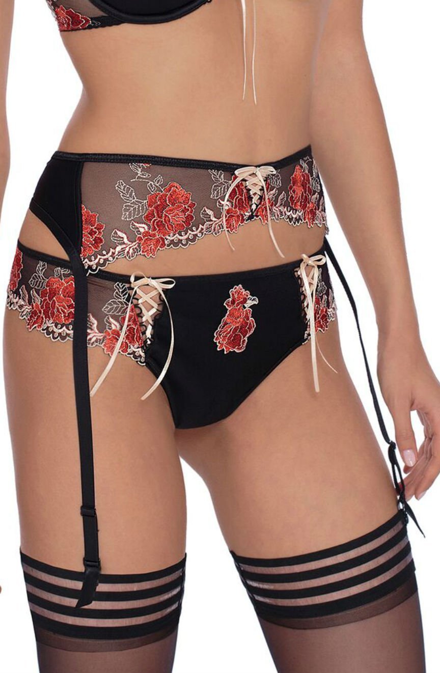 Black suspender belt with red floral embroidery and lace-up detail, paired with matching briefs and stockings