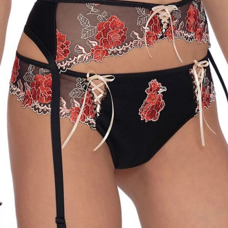 black brief with red floral embroidery, lace-up details, and matching garter belt from Roza
