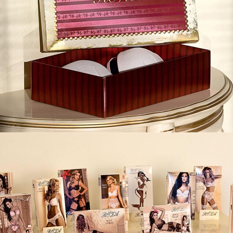 Roza branded gift box with gold trim and striped lid, open to reveal contents, displayed on elegant table