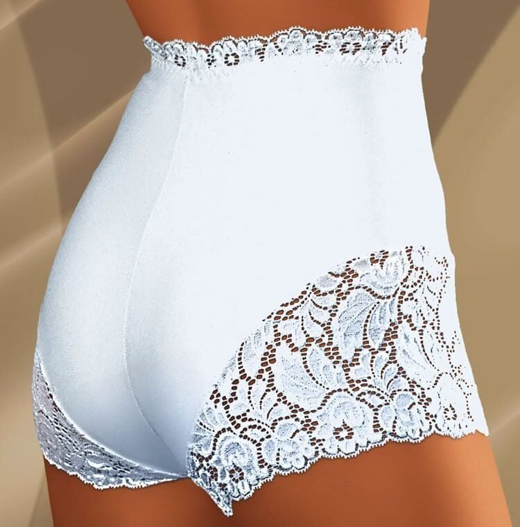 Wolbar Vega white high-waisted shorts with floral lace trim on legs and waistband, shown on model